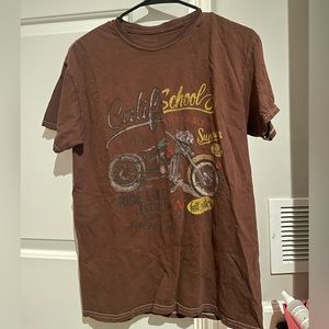 Tilly’s brown t-shirt